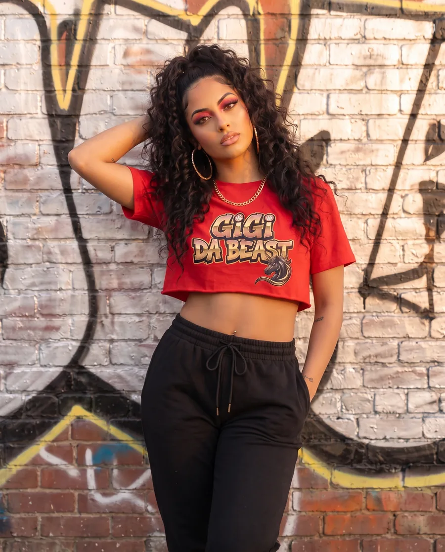 Model wearing the red Gigi Da Beast crop top with the gold logo